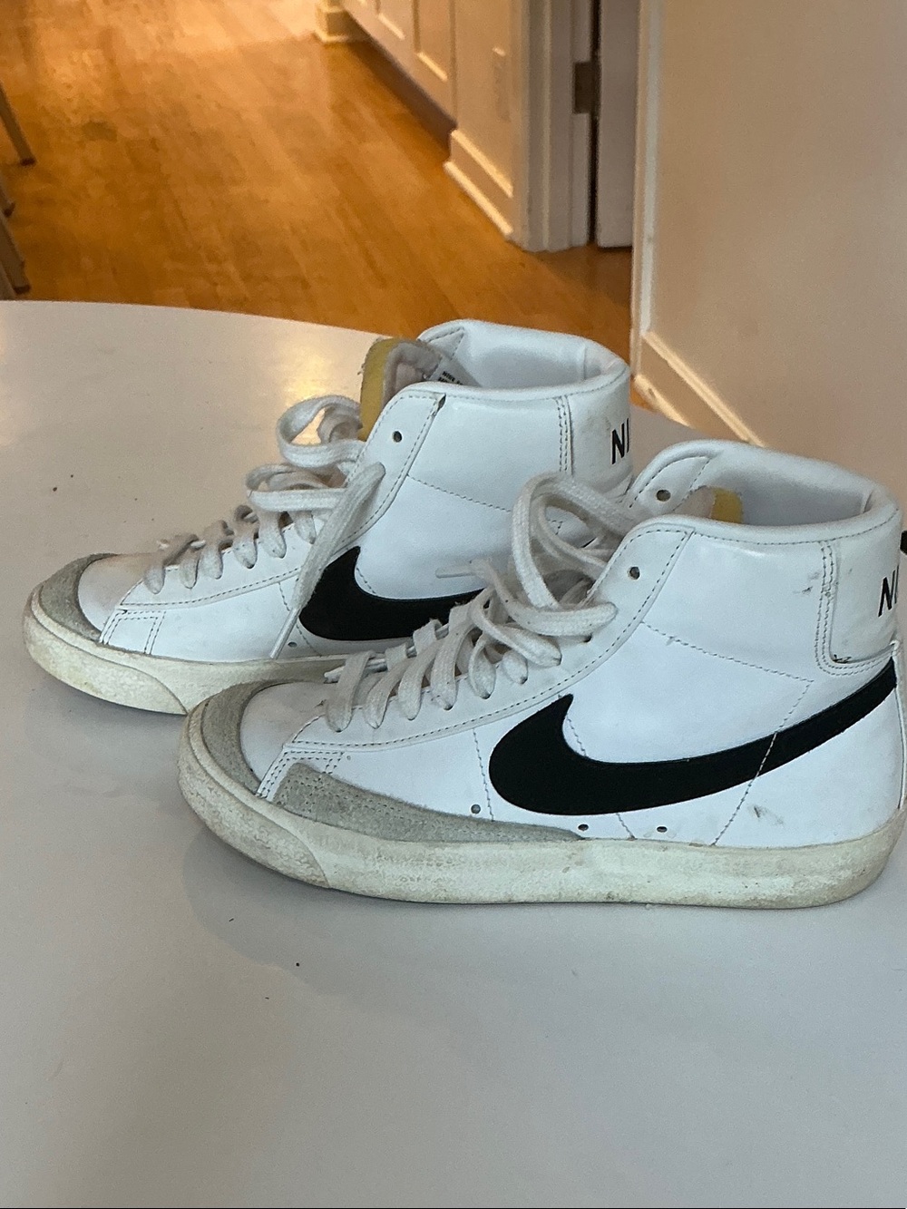 Nike White High-Top Sneakers with Black Swoosh Accent